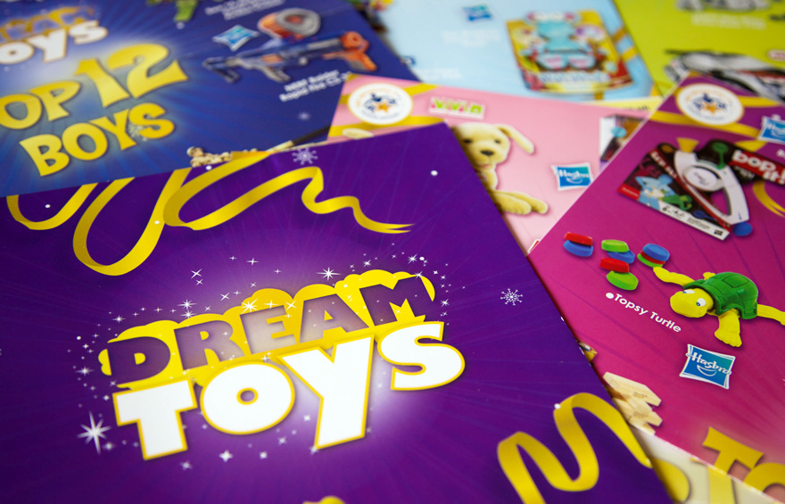 Close up photo of Dream Toys brochures and posters