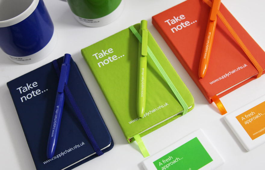 Branding across note pads, pens and mugs